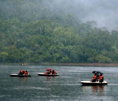 Peaceful lake surrounded by green hills